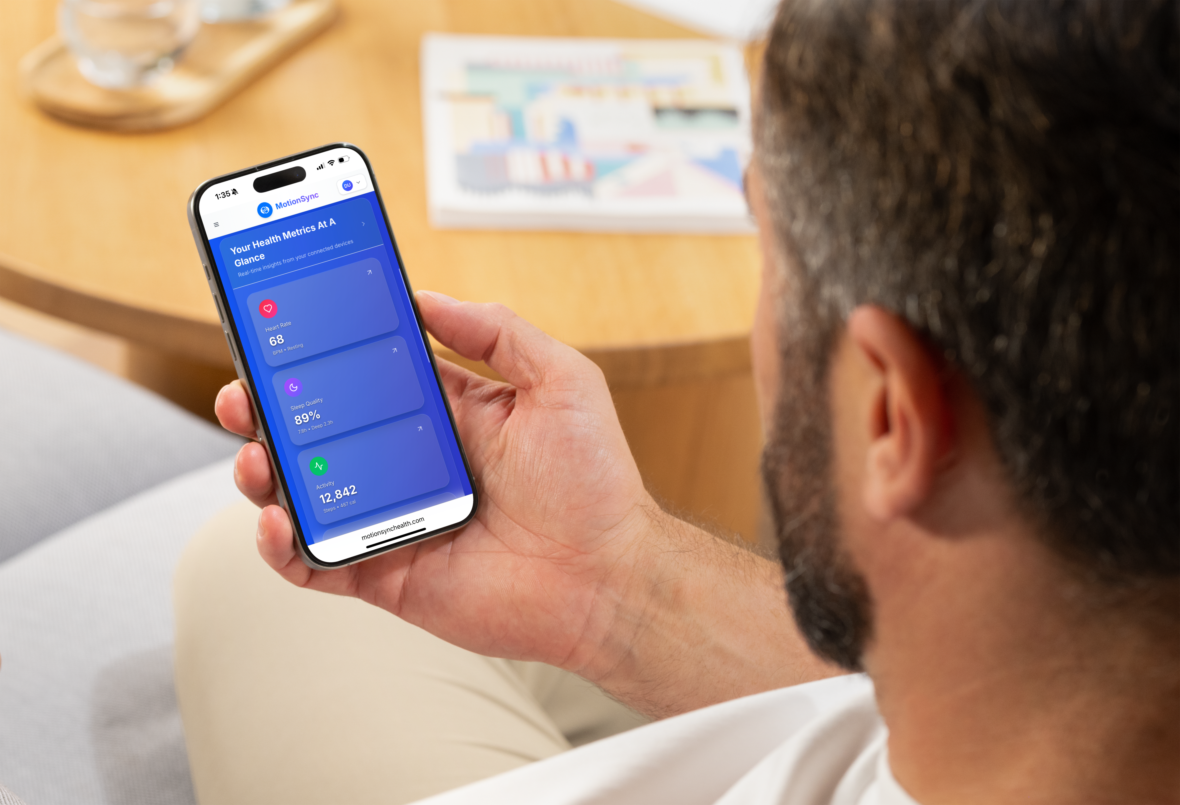 Person checking health trends on MotionSync app showing dashboard